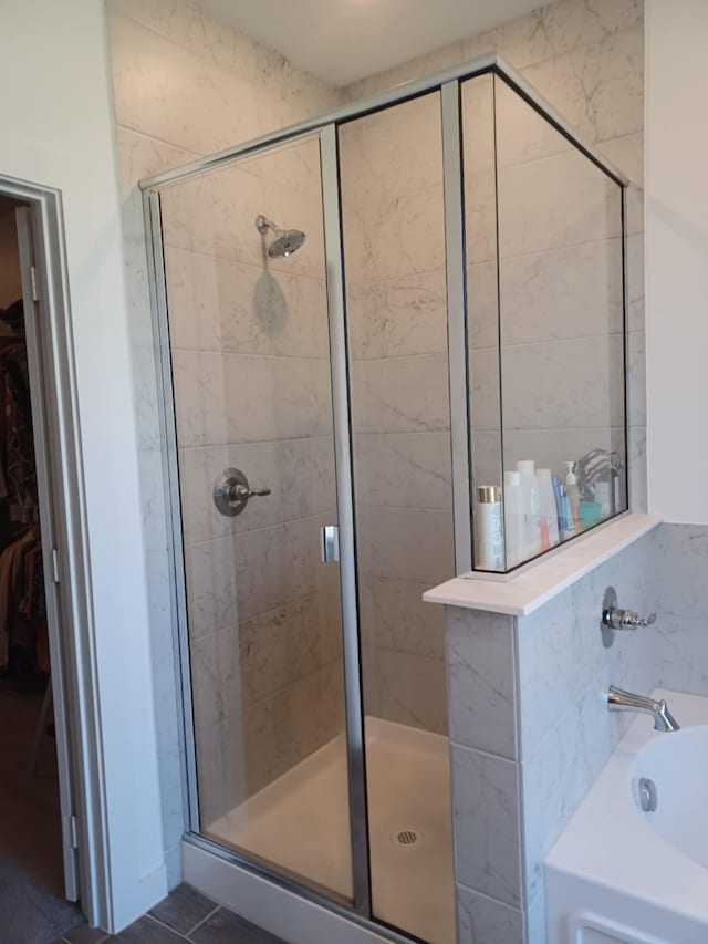 bathroom with independent shower and bath and tile patterned floors