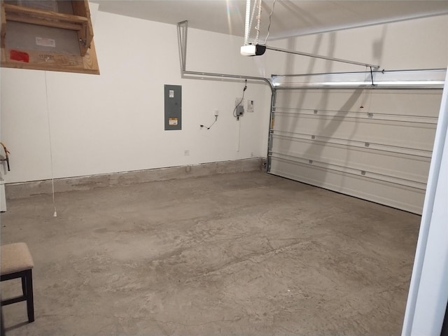 garage with a garage door opener and electric panel