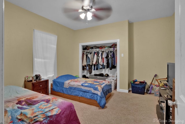 bedroom with carpet flooring, ceiling fan, and a closet