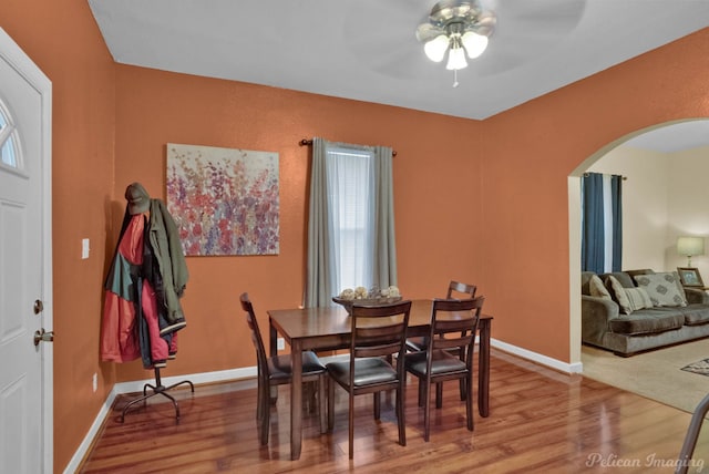 dining room featuring wood-type flooring and ceiling fan