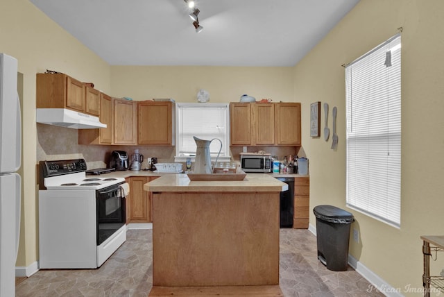 kitchen featuring tasteful backsplash, electric range oven, a center island, and black dishwasher