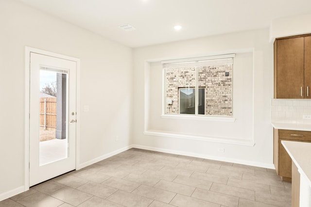 unfurnished dining area featuring visible vents, baseboards, and recessed lighting