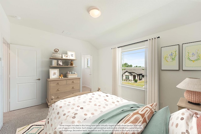 carpeted bedroom featuring lofted ceiling