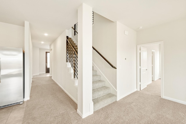 stairway featuring recessed lighting, carpet, and baseboards