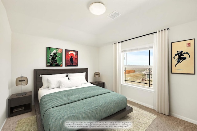 carpeted bedroom featuring visible vents and baseboards