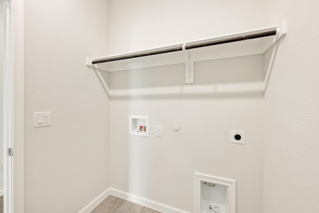 laundry room featuring laundry area, baseboards, gas dryer hookup, hookup for a washing machine, and hookup for an electric dryer