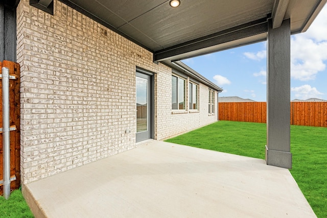 view of patio featuring fence