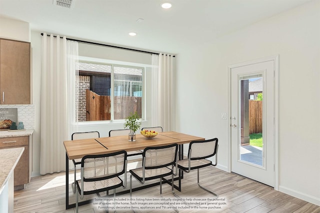 dining area with light hardwood / wood-style floors