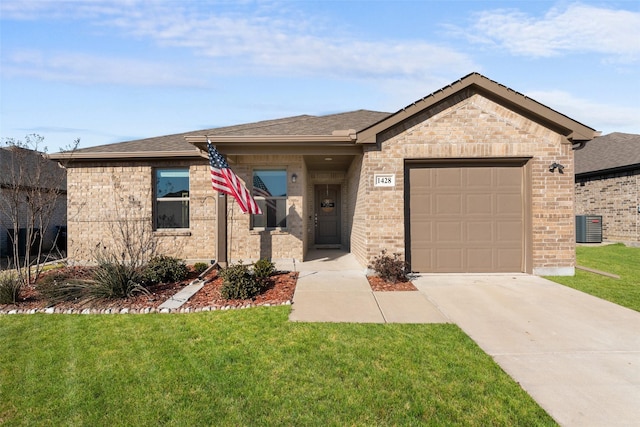 view of front of home featuring a garage and a front lawn