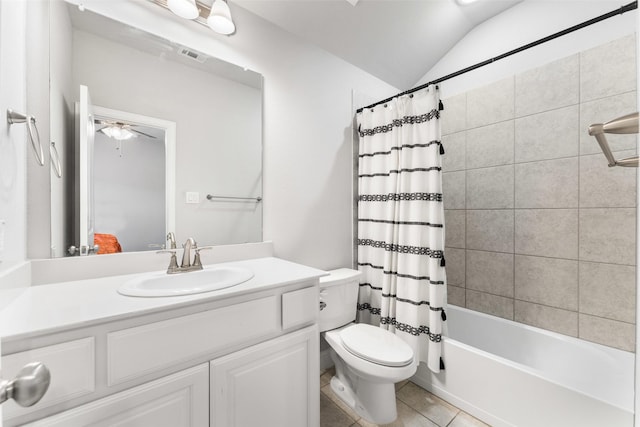 full bathroom with tile patterned flooring, vanity, shower / tub combo, toilet, and vaulted ceiling