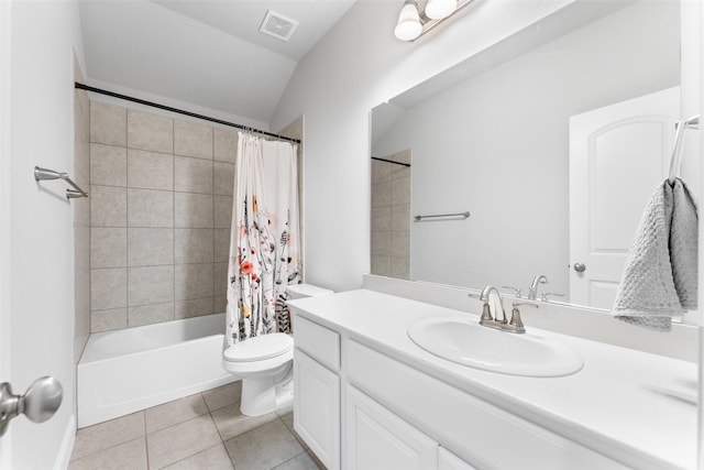 full bathroom featuring tile patterned flooring, vanity, shower / bath combination with curtain, toilet, and vaulted ceiling