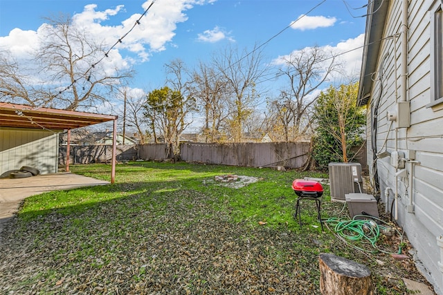 view of yard featuring a patio area and central AC