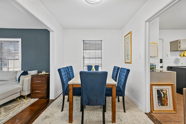 dining space featuring dark hardwood / wood-style flooring