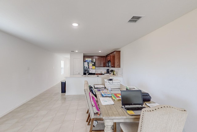 dining area featuring light tile patterned flooring