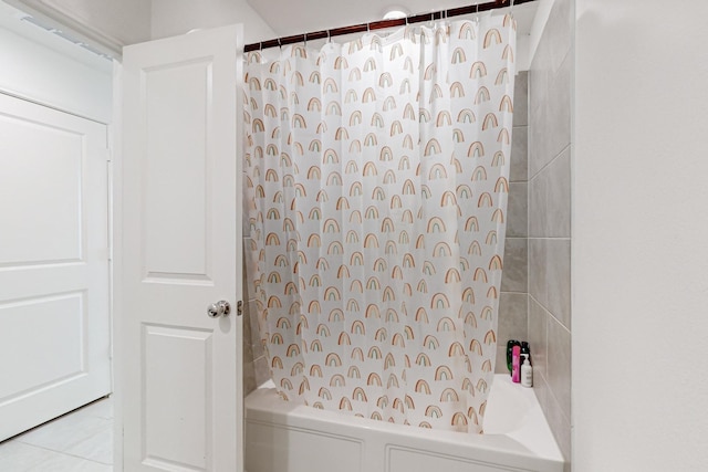 bathroom featuring shower / bath combination with curtain and tile patterned floors