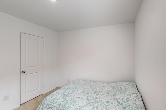 bedroom with light colored carpet