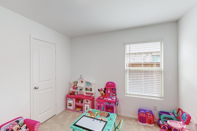 game room with light colored carpet