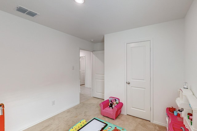 rec room with light carpet