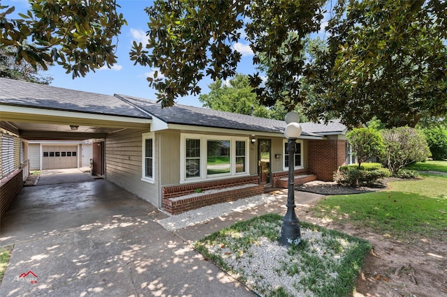 ranch-style home featuring a carport