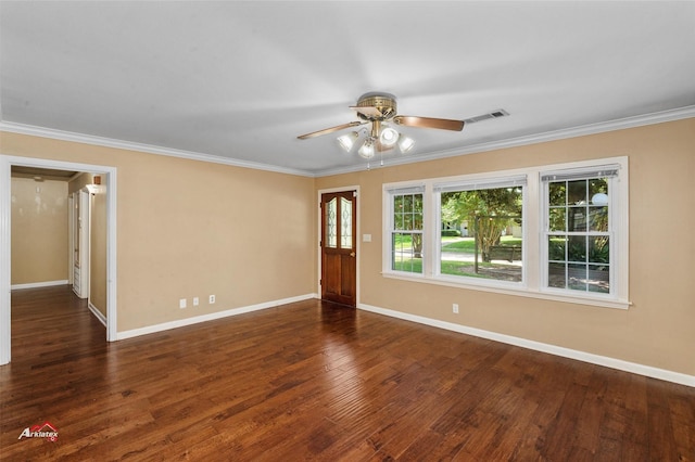 spare room featuring dark wood-type flooring, ceiling fan, and ornamental molding