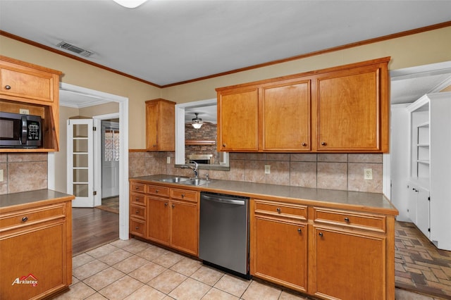 kitchen featuring decorative backsplash, sink, crown molding, and stainless steel appliances