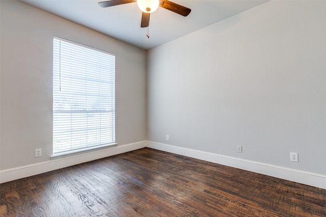 empty room featuring ceiling fan and dark hardwood / wood-style flooring