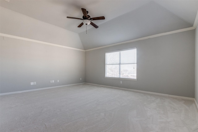 unfurnished room with lofted ceiling, crown molding, light colored carpet, and ceiling fan