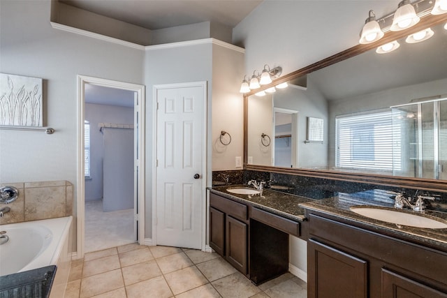 bathroom featuring vanity, tile patterned floors, a bathing tub, and lofted ceiling