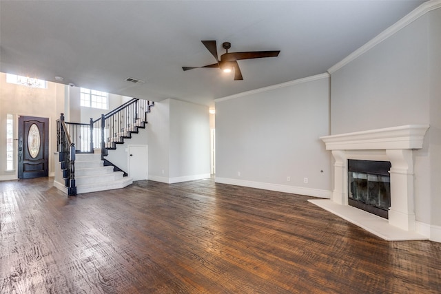 unfurnished living room with crown molding, dark hardwood / wood-style floors, and ceiling fan