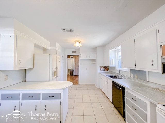 kitchen featuring dishwasher, sink, white cabinets, white fridge with ice dispenser, and range