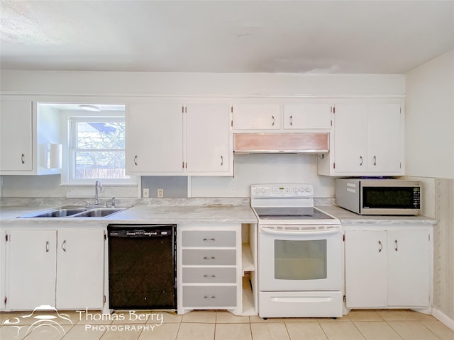 kitchen featuring white cabinetry, sink, and white appliances