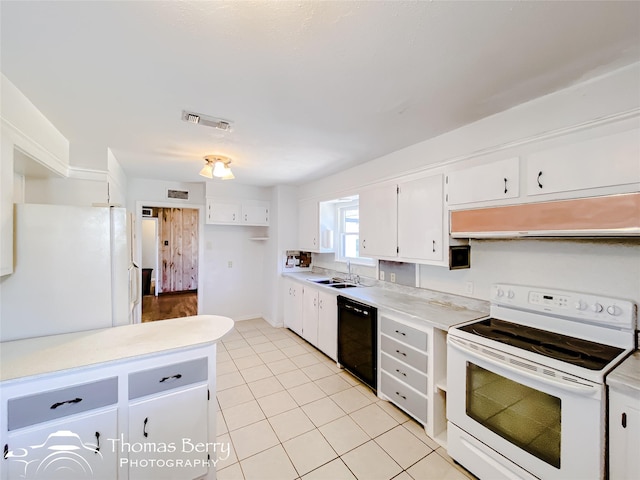 kitchen featuring sink, light tile patterned floors, white cabinets, and white appliances