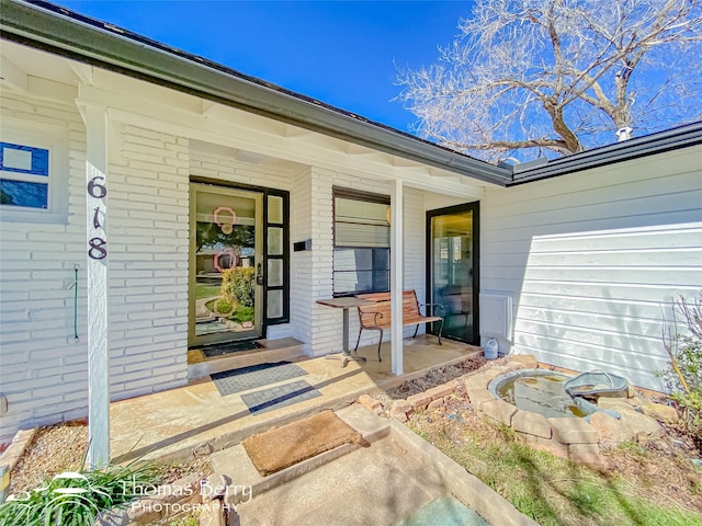 doorway to property featuring a patio