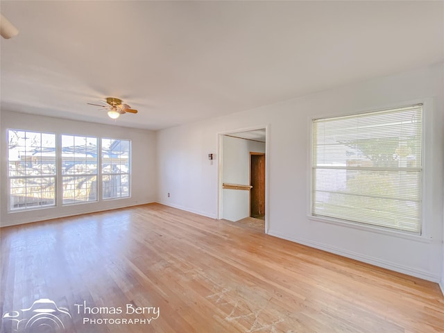 unfurnished room featuring ceiling fan, a healthy amount of sunlight, and light hardwood / wood-style floors