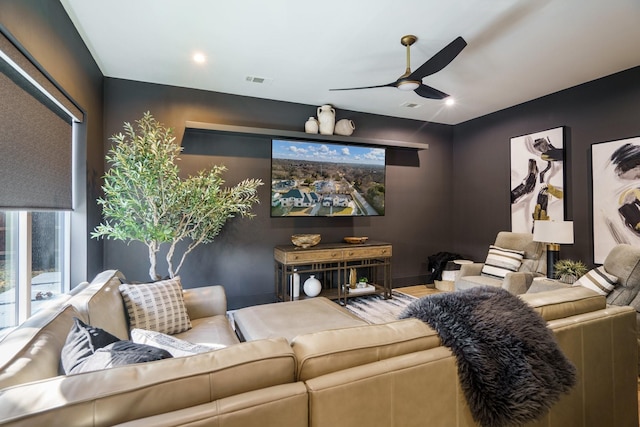 home theater room with ceiling fan