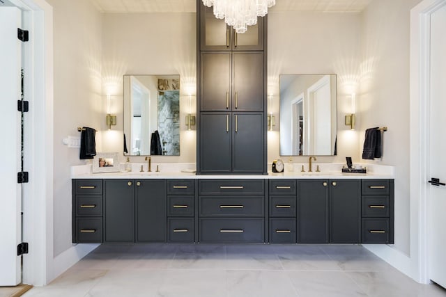 bathroom with vanity and a chandelier