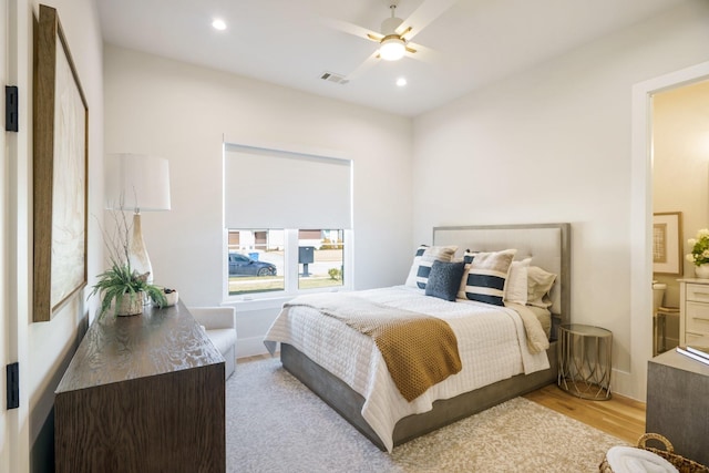 bedroom featuring light hardwood / wood-style flooring and ceiling fan