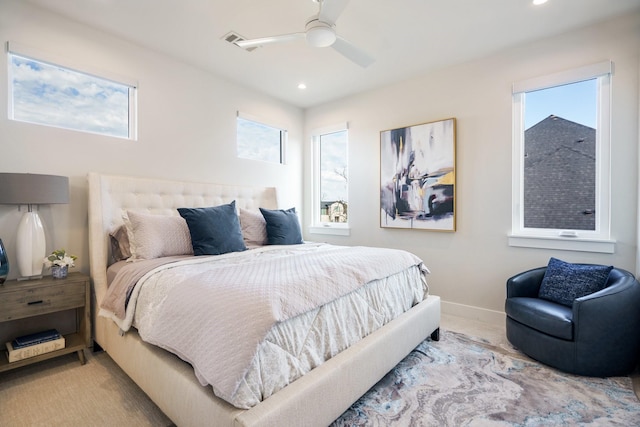 bedroom featuring ceiling fan and light colored carpet