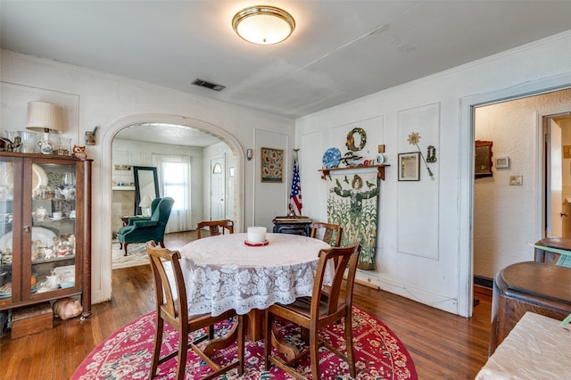 dining space featuring dark hardwood / wood-style flooring