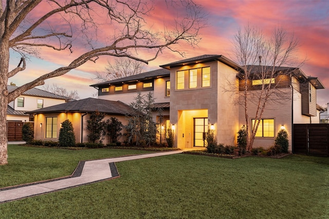 view of front of property with a lawn