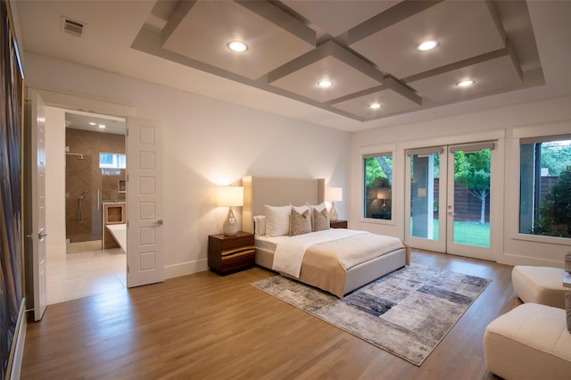 bedroom with light hardwood / wood-style floors and access to outside