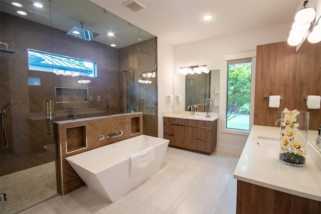 bathroom with separate shower and tub and vanity