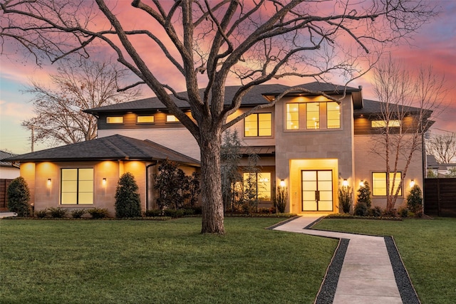 prairie-style home with a lawn