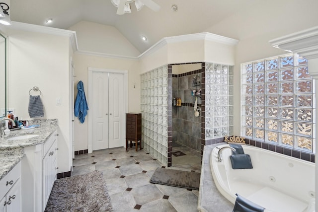 bathroom featuring ceiling fan, vanity, separate shower and tub, and vaulted ceiling