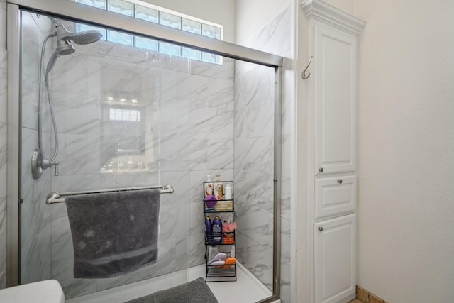 bathroom featuring an enclosed shower