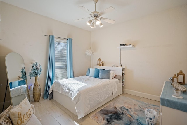 tiled bedroom with ceiling fan