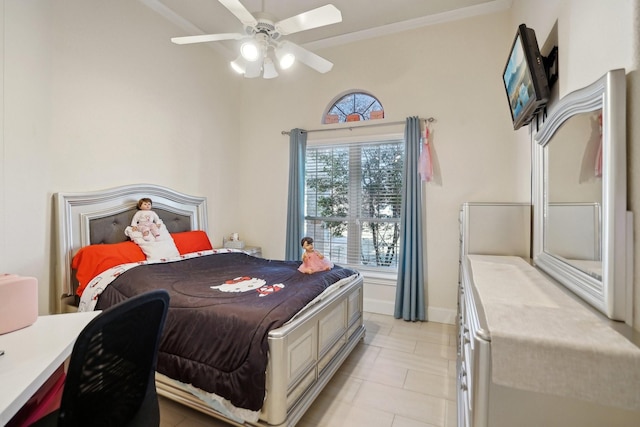 tiled bedroom with ceiling fan and ornamental molding