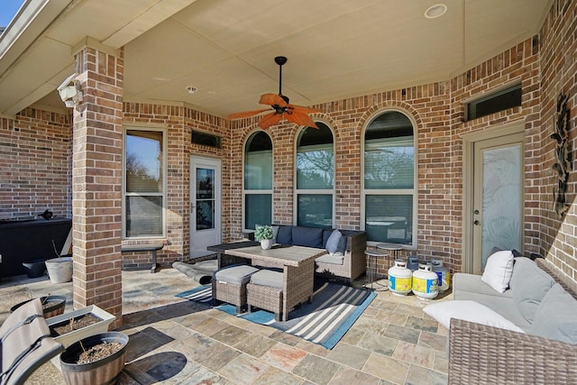 view of patio featuring an outdoor living space and ceiling fan