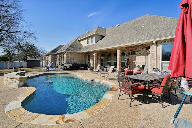 view of pool with a patio area and a jacuzzi