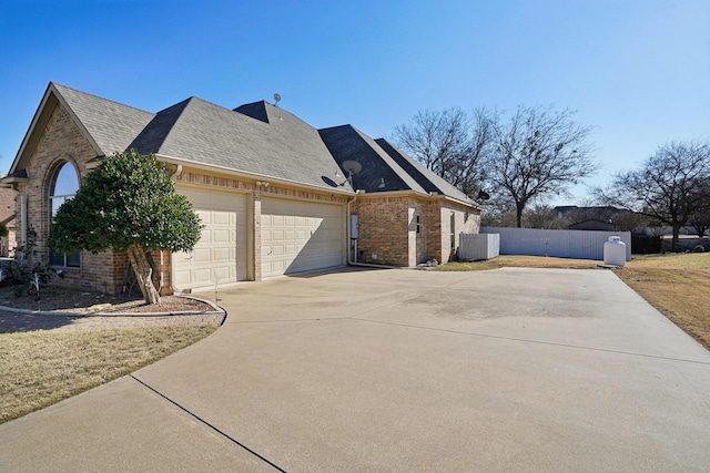 view of side of property featuring a garage